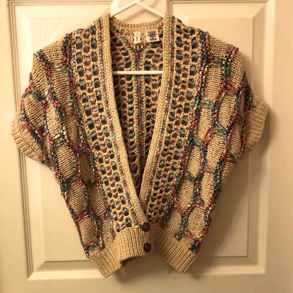 Cotton polyester nylon shrug with varied coloured ribbon ornamentation 2 buttons